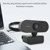 A black webcam device is shown next to a silver laptop, illustrating drive-free plug and play functionality.