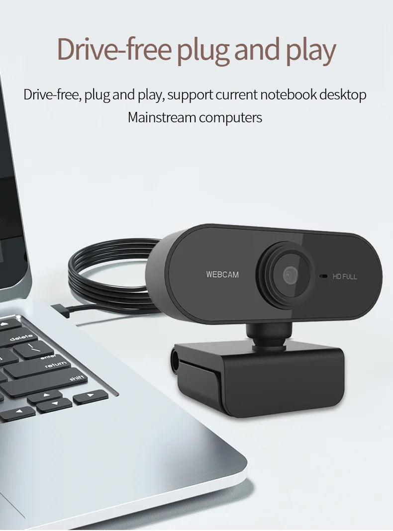 A black webcam device is shown next to a silver laptop, illustrating drive-free plug and play functionality.