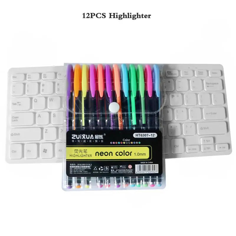 A set of 12 neon colored gel highlighters in a plastic case displayed next to a white keyboard.