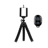 Black flexible mini tripod with a clamp for mounting smartphones and cameras