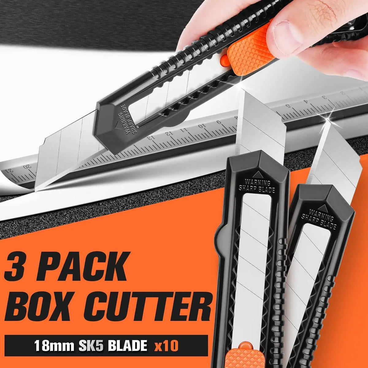 A hand is using a black box cutter with orange handles to cut a piece of paper, showing three packs of 18mm SK5 blades.