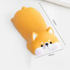 A yellow, ergonomic wrist rest shaped like a fox head for use with a mouse or keyboard.