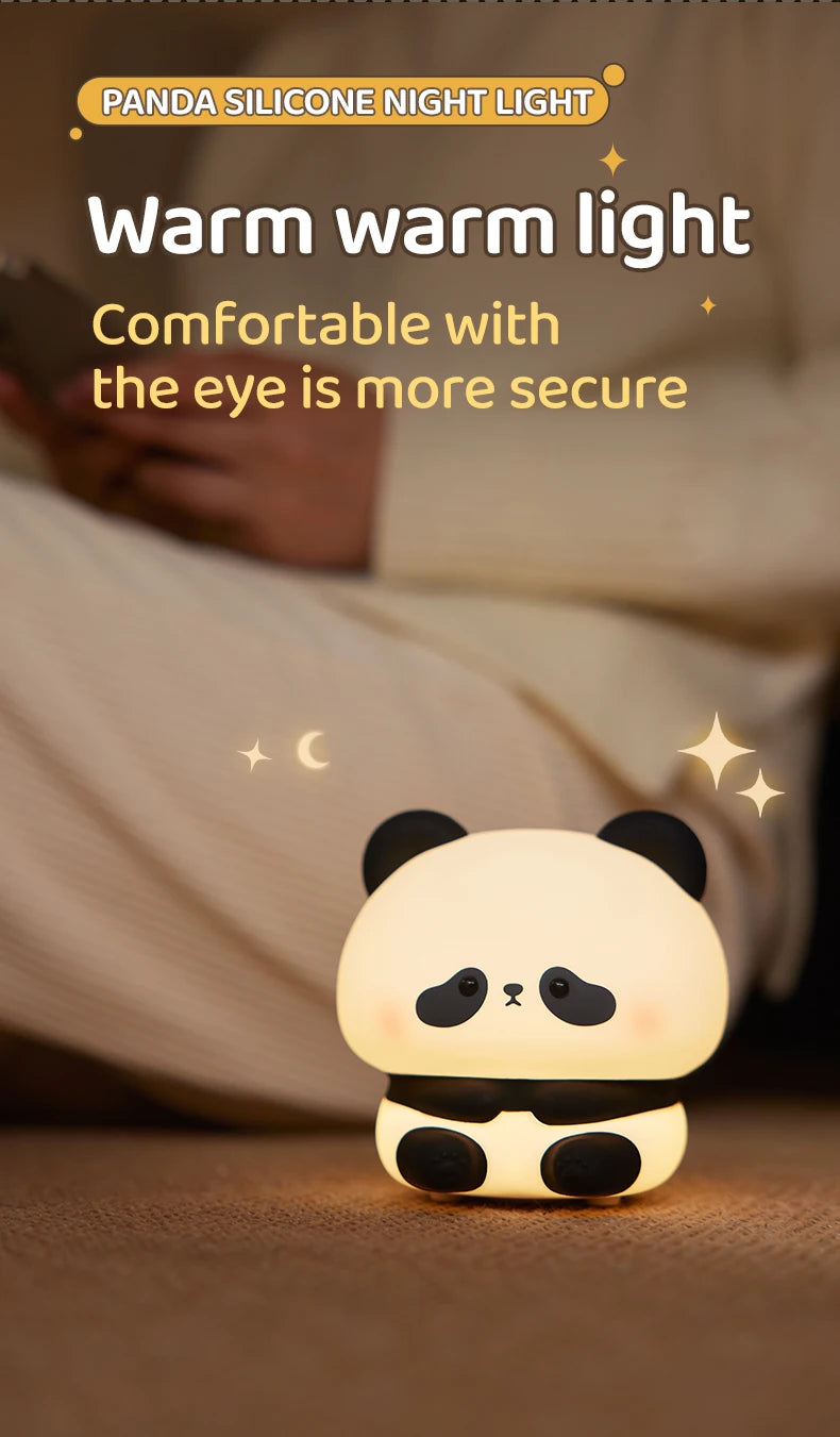 A glowing panda silicone night light rests on a surface, illuminating the surrounding area.