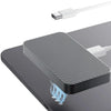 A magnetic wireless charging module rests on a dark surface, with blue electrical arcs visible below it.