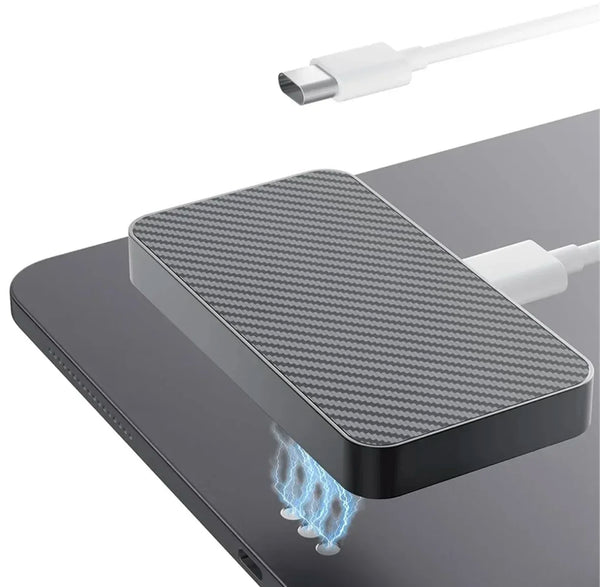 A magnetic wireless charging module rests on a dark surface, with blue electrical arcs visible below it.