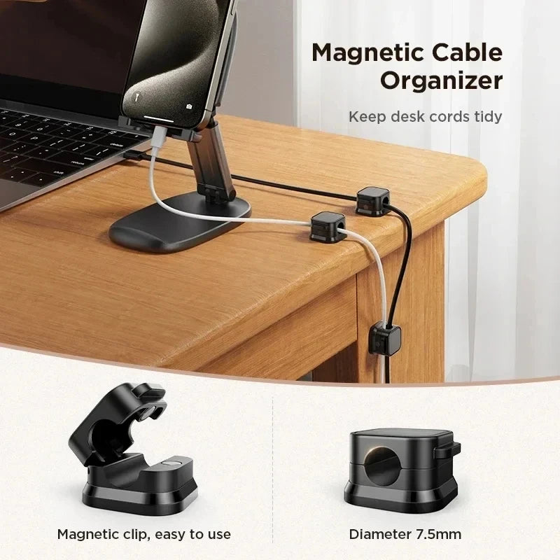Magnetic cable organizer clips used to tidy desk cords on a wooden surface