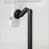 A black five-axis table stand mounted on a white wall, designed to hold mobile phones and tablets.