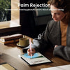 A woman is using a precision stylus pen on an iPad, demonstrating palm rejection technology.