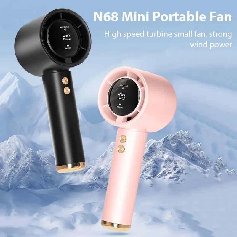 A pink N68 Mini portable fan is shown against a snowy mountain background.