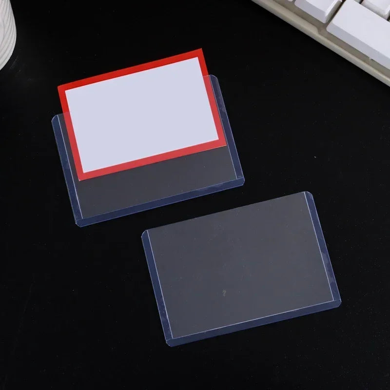 A set of clear protective card sleeves with anti-scratch film, featuring a red and white design.