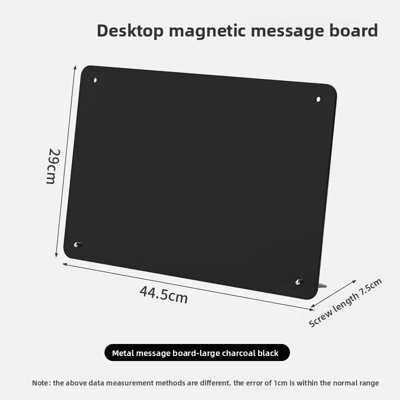 A black desktop magnetic message board with a rectangular shape and mounting holes.