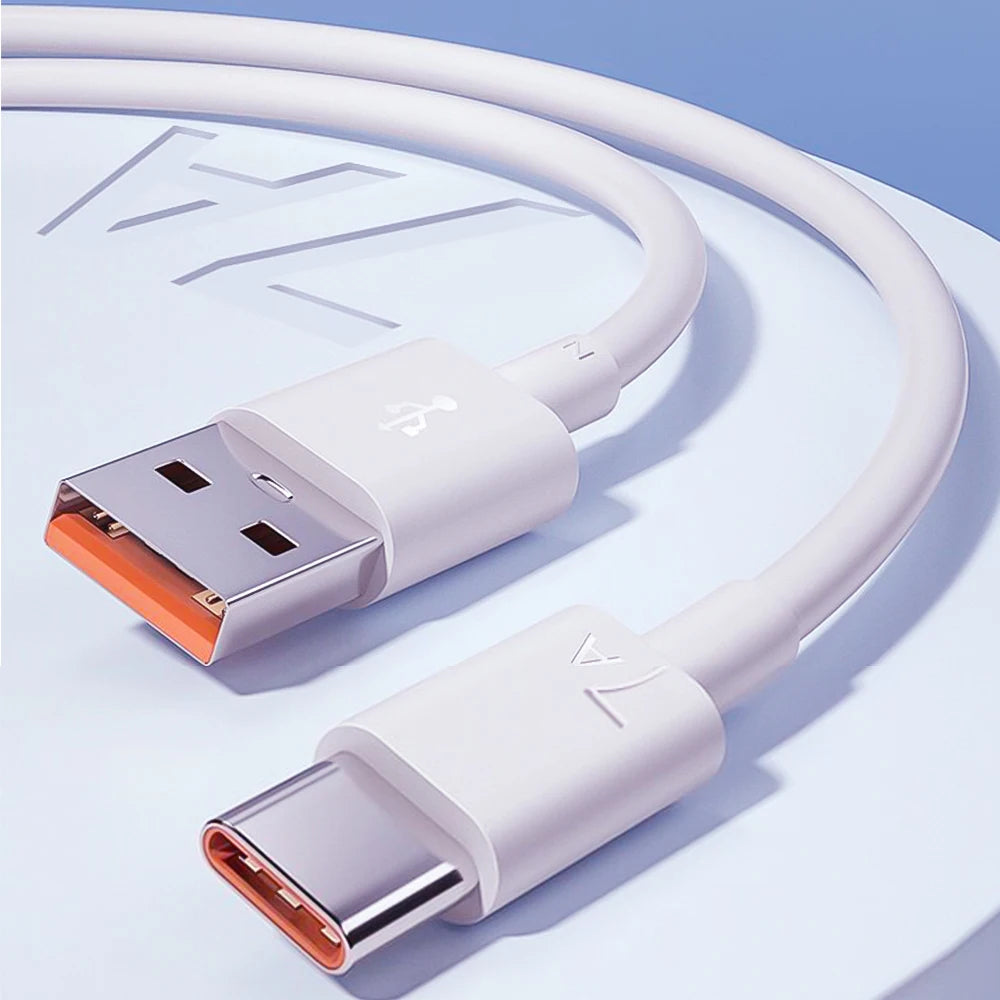 A white USB-C fast charging cable with braided nylon design shown coiled on a light blue surface.