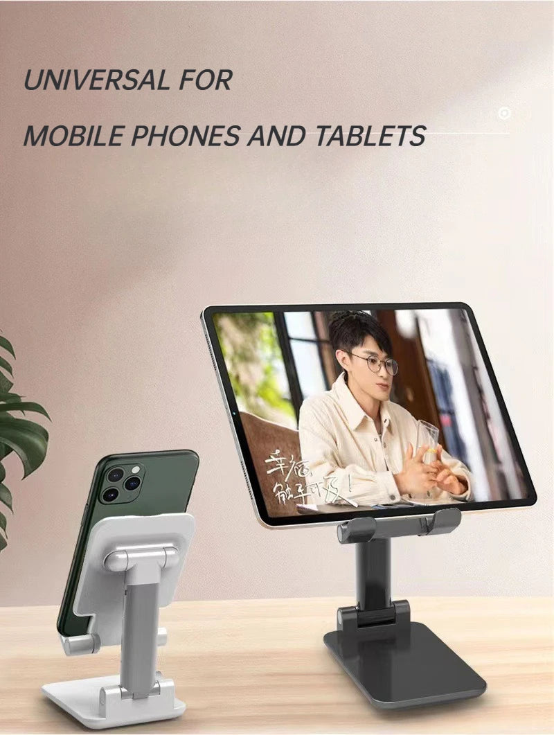 A foldable desktop phone stand is shown supporting a smartphone on a wooden table.