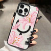 A hand holds a pink lily floral transparent iPhone case featuring a large pink flower design.