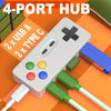 A white 4-port hub with multiple connectors, including USB-A and Type-C ports, shown on an orange background.