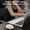 A wireless ergonomic mouse is shown next to a laptop, with a person in the background working.