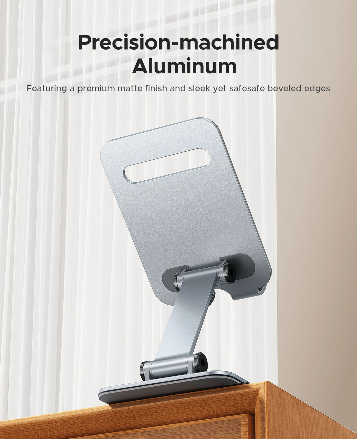 A precision-machined aluminum phone holder stand with a matte finish and beveled edges.