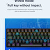 A close-up view of a black wired mechanical gaming keyboard with colorful keycaps and RGB lighting.