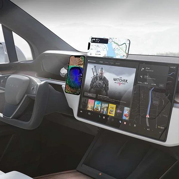 A magnetic phone holder is mounted on a car dashboard, displaying a map and a movie poster.