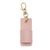 A pink leather pen holder keychain with a gold-toned clasp.