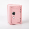 A pink compact home safe box with a metal combo lock and keys.