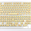 A clear plastic case containing a colorful PBT keycaps set for mechanical keyboards.