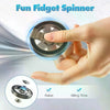 A hand spins a metal fidget spinner, demonstrating its use for relaxation and killing time.
