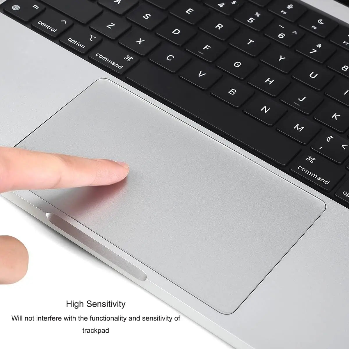 A close-up view of a silver laptop trackpad and keyboard, showing a finger touching the surface.