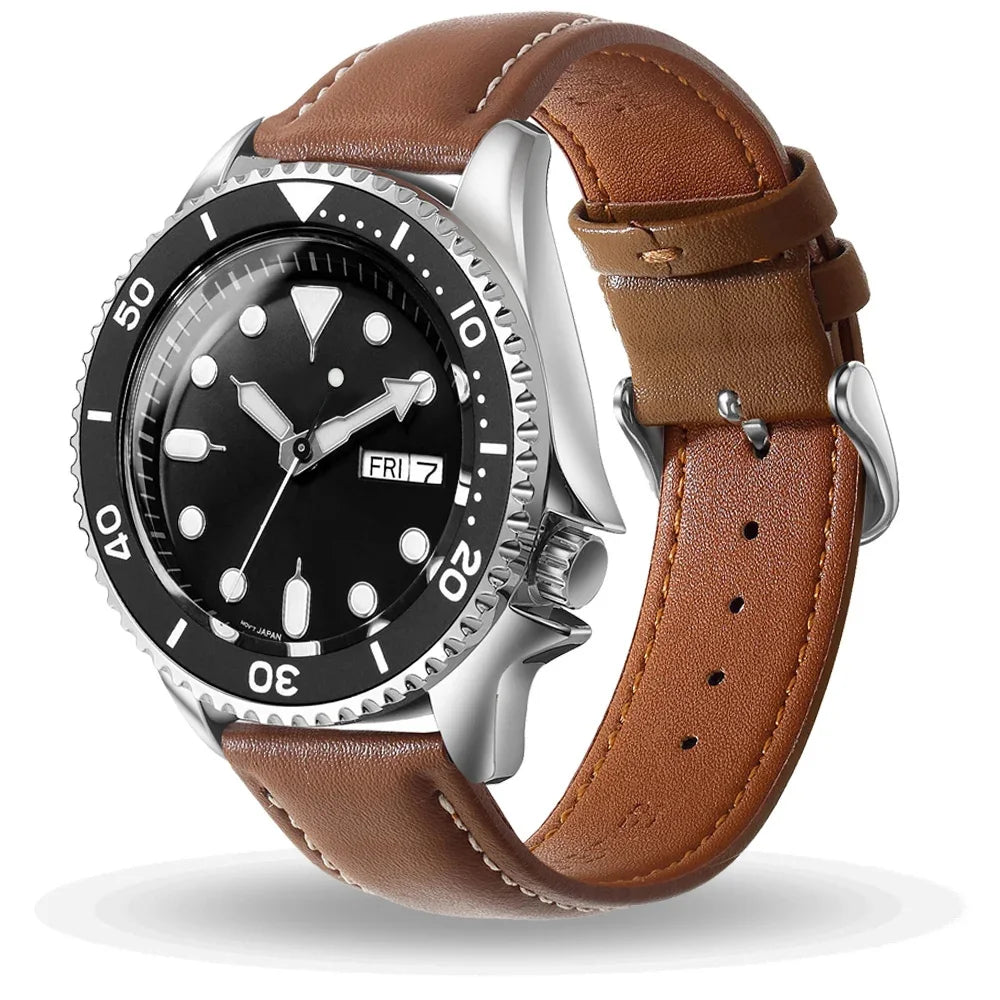 A brown leather watch with a silver casing and black face displaying the time.
