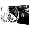 Abstract art desk mat featuring black and white ink style designs with floral elements.