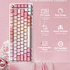 A pink mechanical keyboard featuring a 75% layout, hot-swappable switches, and RGB backlight, displayed on a pink background.