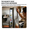 A person is attaching a magnetic phone holder mount to the flat metal surface of a refrigerator door.