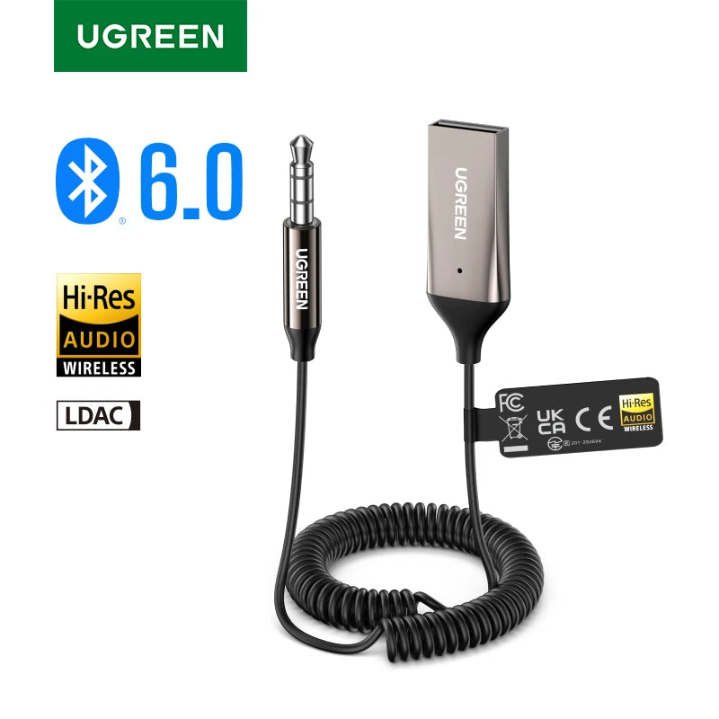 A black portable Bluetooth car audio adapter with a microphone and cable.