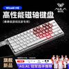 A close-up view of a silver mechanical gaming keyboard with red keycaps and an Aura logo on the side.
