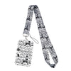 A black and white patterned cartoon cat card holder lanyard with a neck strap.