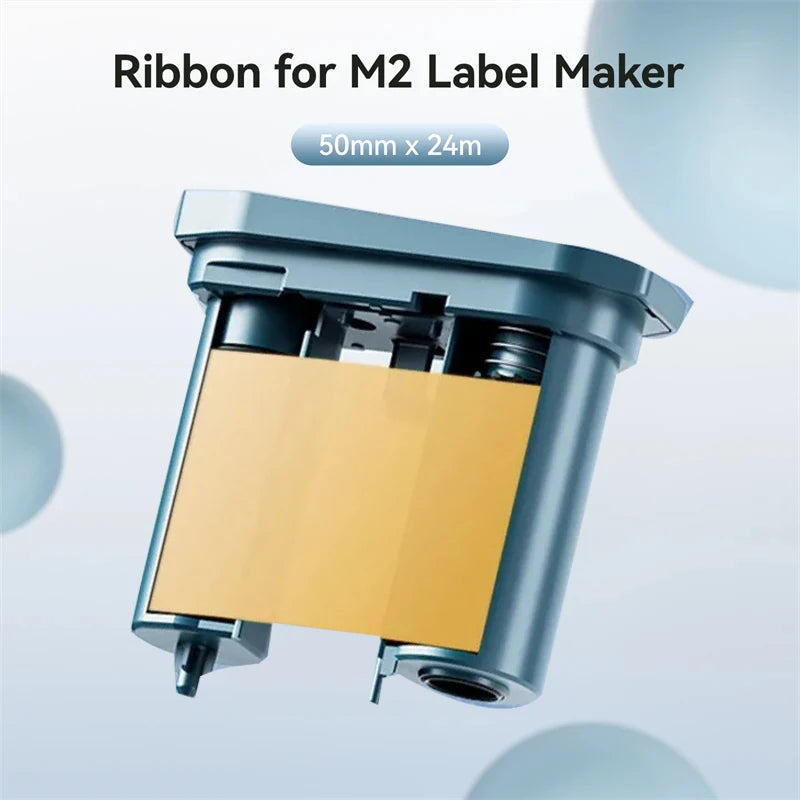 A ribbon for an M2 label maker is shown, featuring a yellow label and silver plastic components.