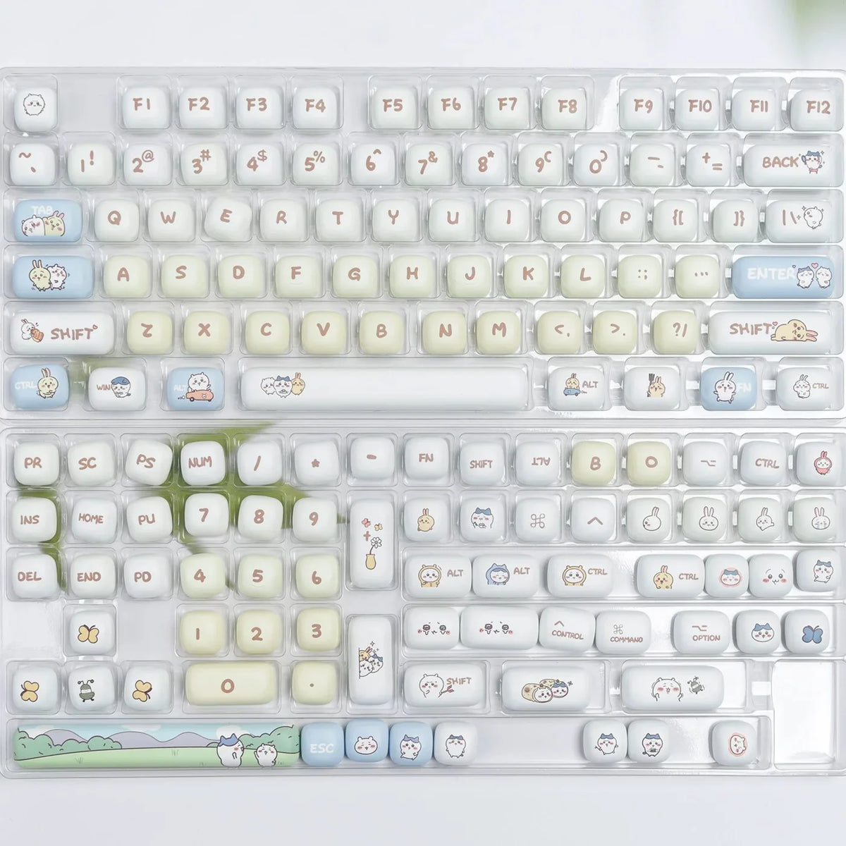 A close-up view of a white mechanical keyboard featuring light-colored dye-sublimated PBT keycaps.