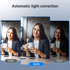A woman is using a Full HD Mini Webcam with Microphone for automatic light correction.