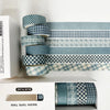 A set of six rolls of blue plaid washi tape in various patterns, including grid and polka dot designs, displayed in a white b