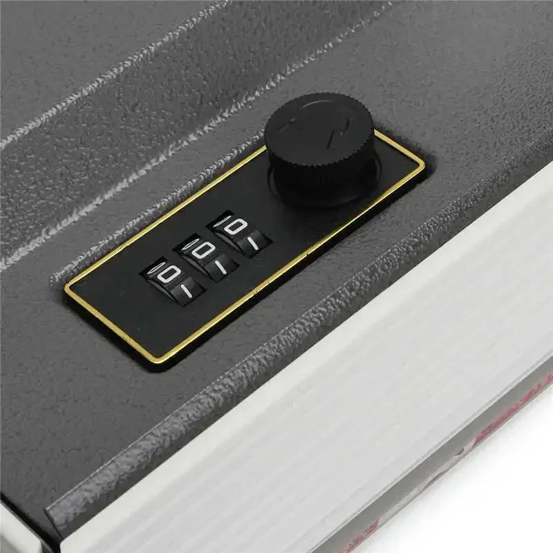 A black combination lock safe box with a round dial and four numbered buttons is shown on a dark surface.