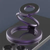 A purple MagSafe double-sided phone ring holder stand resting on a dark surface.