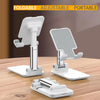 A white foldable adjustable portable desktop phone stand with a phone and a stand for live streaming.