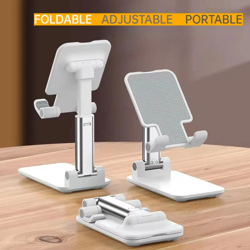 A white foldable adjustable portable desktop phone stand with a phone and a stand for live streaming.