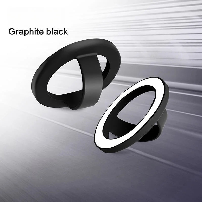 A black magnetic silicone phone grip with a foldable stand shown in various views.