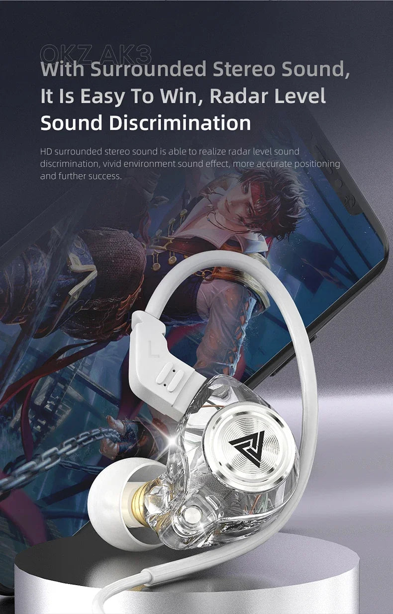 White wired earphones with a clear housing and microphone resting on a dark surface.