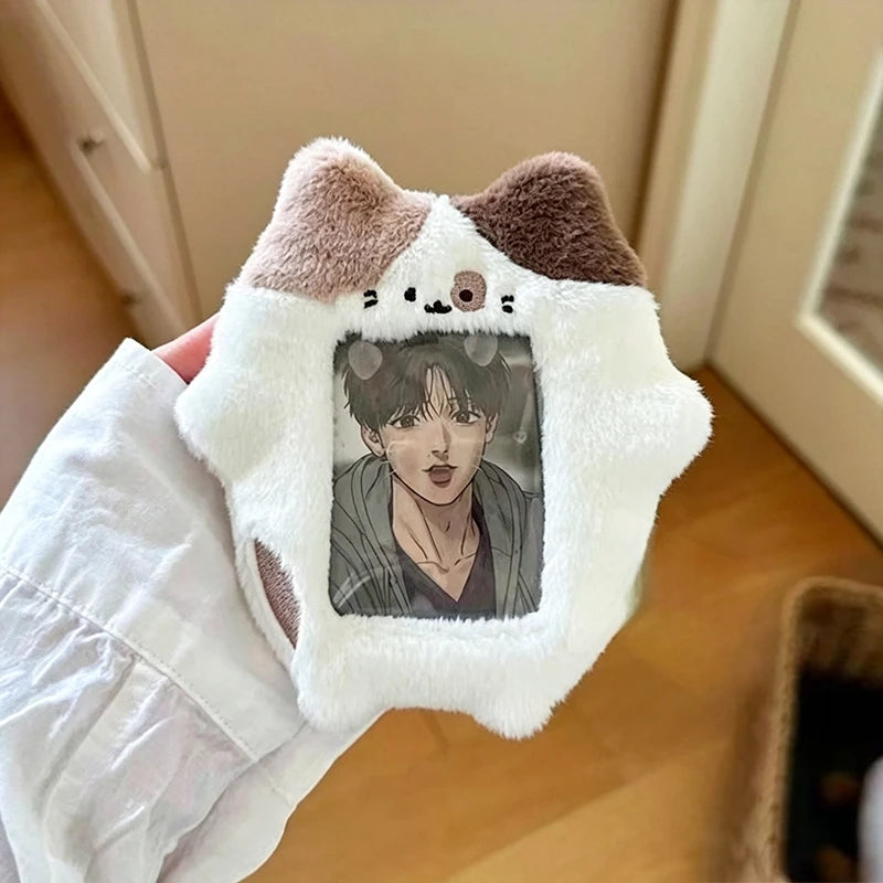 A white plush holder with brown ears featuring a photograph of a male K-pop idol.