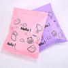 Two pink and purple reusable plastic mailing bags with cloud and hello doodles