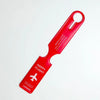 A bright red durable PVC luggage tag with a loop for travel identification.