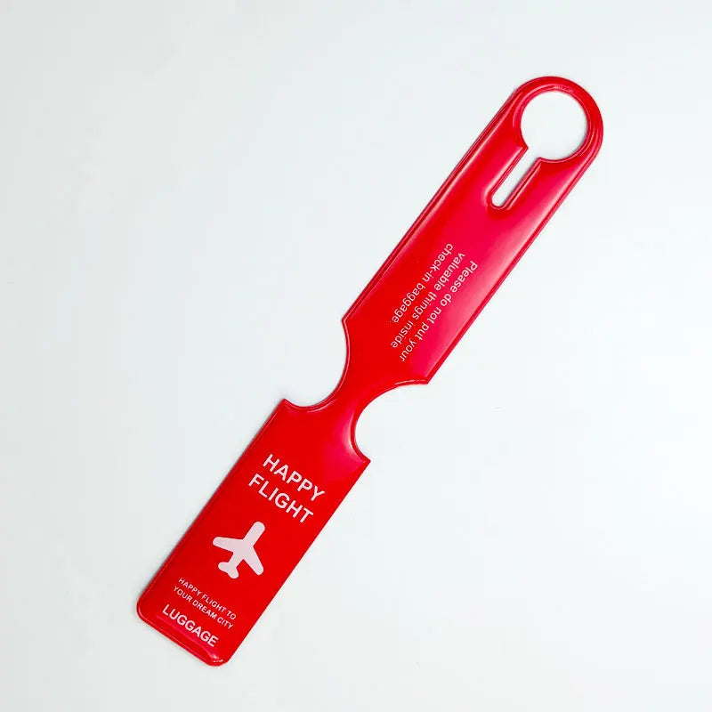 A bright red durable PVC luggage tag with a loop for travel identification.