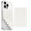 A white silicone suction cup phone holder with multiple suction cups and a matching silicone pad.
